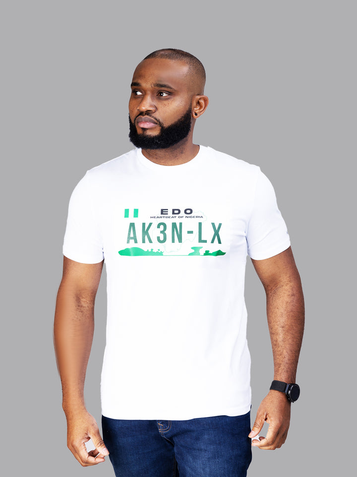 Male model wearing the AkénLuxe Number Plate T-Shirt, styled effortlessly for a modern, relaxed streetwear look.
