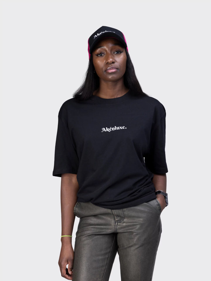 Detailed view of the AkénLuxe logo print on the Oversized T-Shirt, highlighting its sharp design and premium fabric texture.
